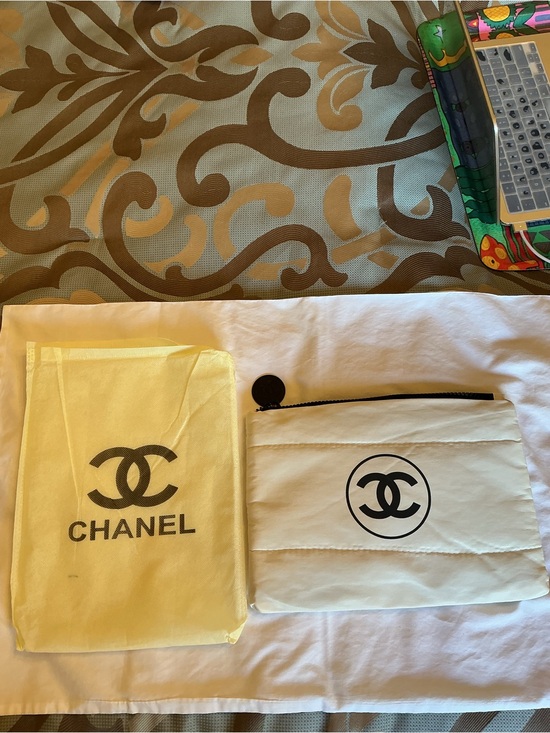 CHANEL Handbags - CHANEL White Pouch with Black CC Logo